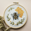 embroidery-bee-honeycomb-flowers-white-surface