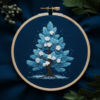 close-up-cross-stitched-picture-tree-white-flowers