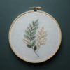 embroidery-leaf-branch-white-fabric