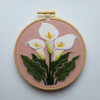 embroidery-white-flower-green-leaves-pink-background