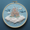 close-up-embroideryed-picture-castle-cloud