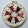 embroidery-circular-design-flowers-white-surface