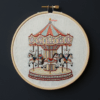 close-up-cross-stitched-picture-carousel