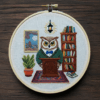 close-up-cross-stitched-picture-owl-library