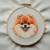 close-up-dog-embroidered-white-cloth