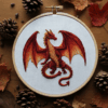 close-up-dragon-embroideryed-hoop-pine-cones