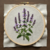 close-up-embroidery-purple-flowers-white-cloth