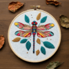 close-up-embroideryed-dragonfly-leaves-table