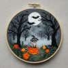 close-up-embroideryed-picture-raccoon-pumpkin