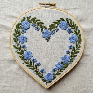 heart-shaped-embroidery-blue-flowers-white-cloth