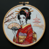 arafed-embroidery-geisha-woman-holding-fan
