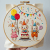 arafed-embroidery-group-bunnies-balloons-cake