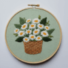 embroidery-basket-daisies-green-background