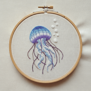 embroidery-jellyfish-pearls-white-cloth