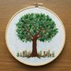embroidery-tree-flowers-leaves-wooden-surface