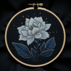 embroidery-white-flower-blue-leaves-black-background