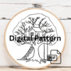 close-up-cross-stitched-picture-tree-house