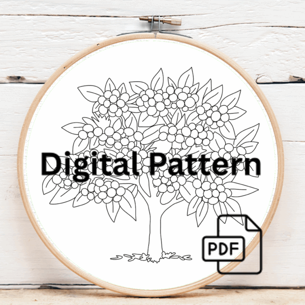 close-up-cross-stitched-picture-tree-orange-berries