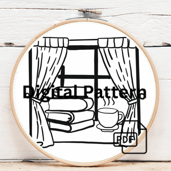 close-up-cross-stitched-picture-window-cup-coffee