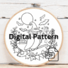 close-up-cross-stitched-picture-owl-broom