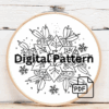 close-up-cross-stitched-snowflake-ornament-pine-tree