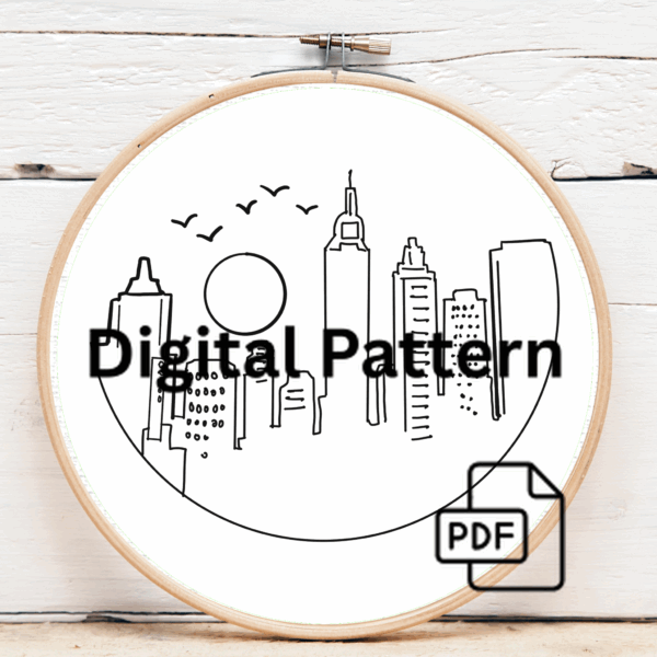 close-up-embroidery-city-birds-flying-sky