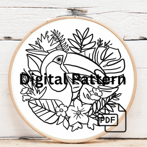 close-up-embroidery-toucan-tropical-leaves-flowers