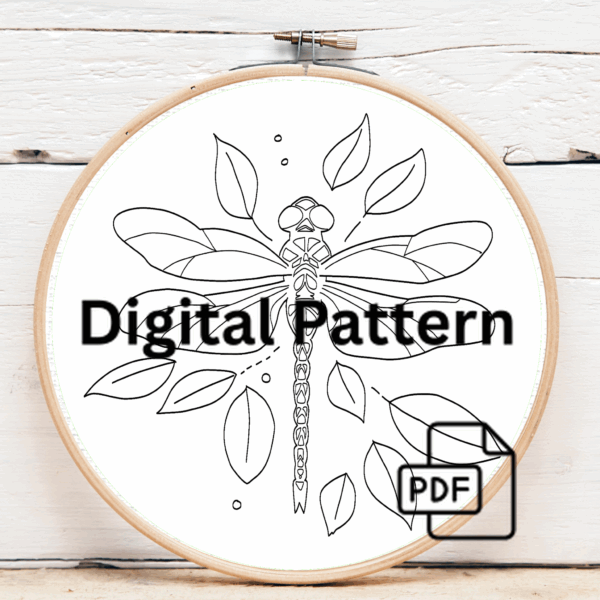 close-up-embroideryed-dragonfly-leaves-table