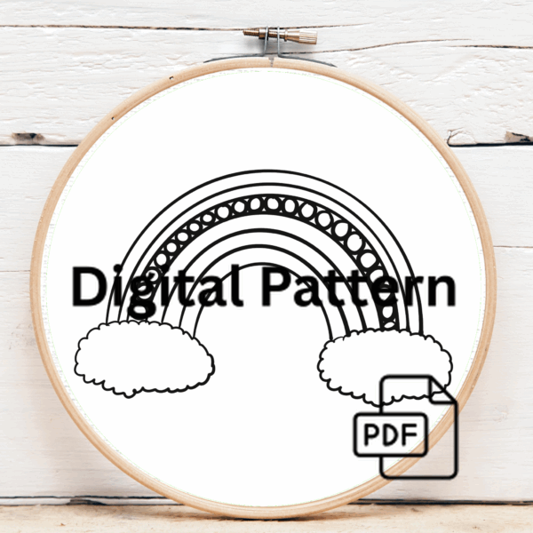 close-up-embroideryed-rainbow-clouds-white-surface