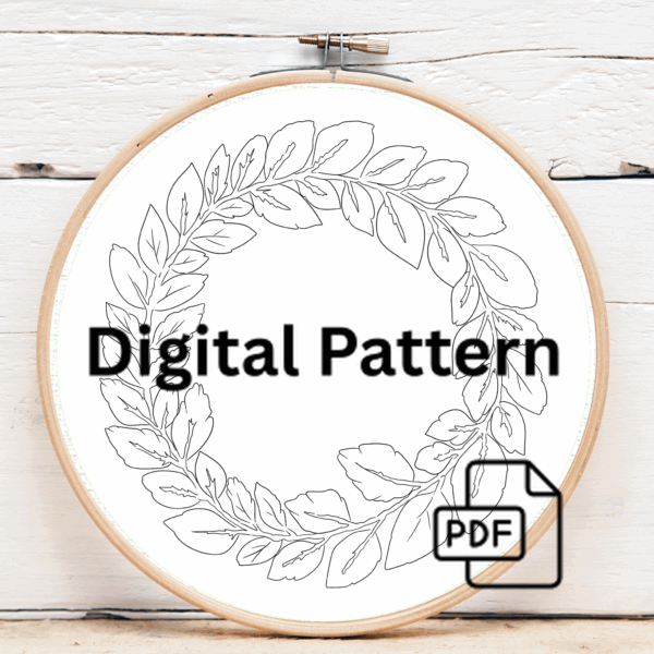 close-up-embroideryed-wreath-leaves-brown-surface