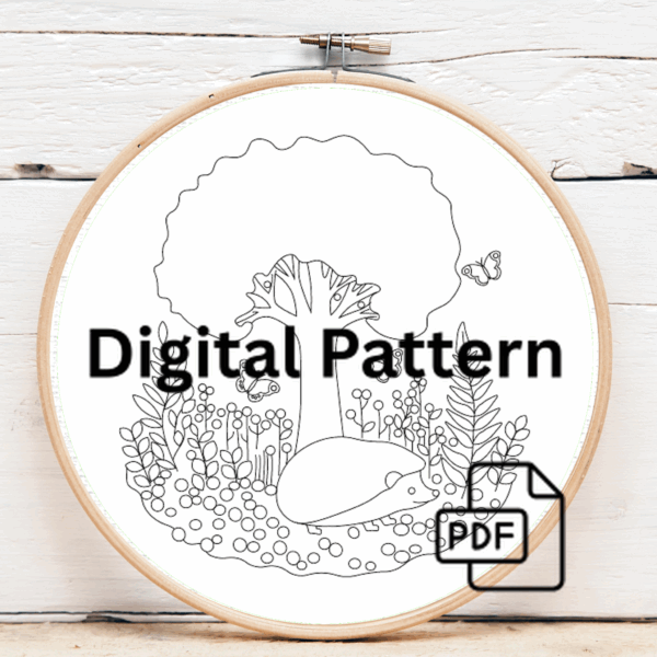 close-up-person-holding-embroideryed-hedge-field