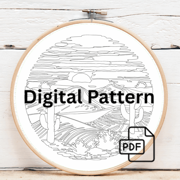 close-up-person-holding-embroideryed-picture-desert