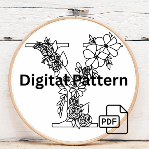 arafed-embroidery-letter-v-bow-brown-background
