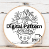 embroidery-vase-flowers-being-held-by-person
