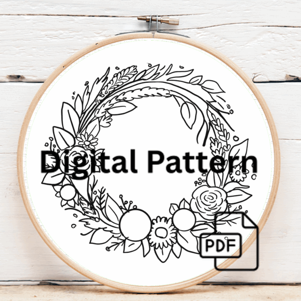 embroidery-wreath-flowers-leaves-linen-surface