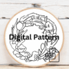 embroidery-wreath-flowers-leaves-white-surface