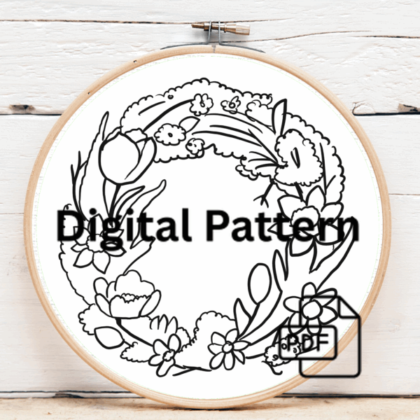 embroidery-wreath-flowers-leaves-white-surface