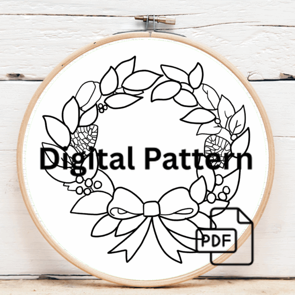 close-up-cross-stitch-wreath-pine-cones-red-ribbon