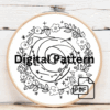 embroidery-circular-design-flowers-stars-black-surface