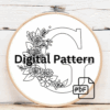 close-up-cross-stitched-letter-bow-string