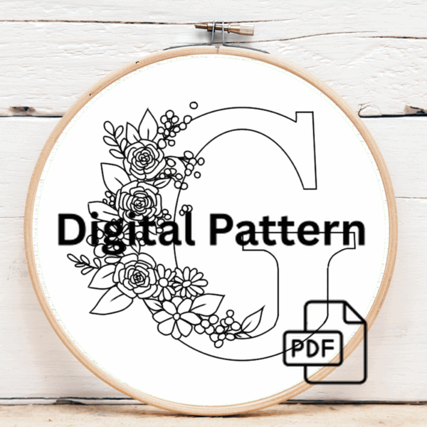 close-up-cross-stitched-letter-bow-string