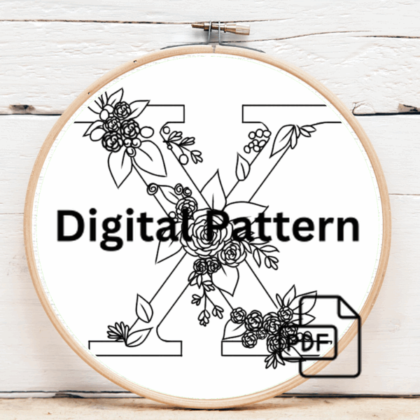 close-up-cross-stitched-letter-ribbon